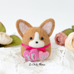 Valentine Corgi holding XOXO hearts